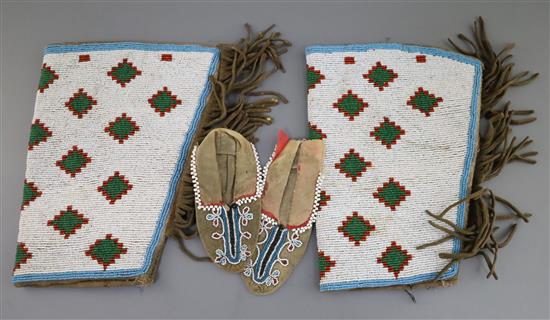 A pair of 19th century Native American Northern Plains beadwork skin childs moccasins, 9in.